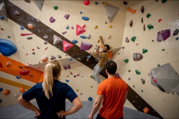 Climbing coach with students